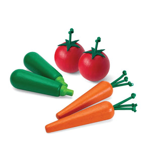 Produce Set B: two zucchini, two tomatoes, and two carrots made of wood.