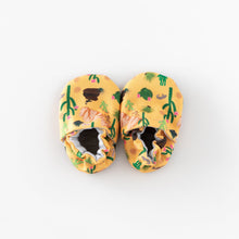 Load image into Gallery viewer, Cabooties Arizona Animals: Yellow baby shoes with desert illustrations, rubber soles, and elastic ankle closures by Cabooties.

