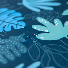 Load image into Gallery viewer, Close-up of water droplets on Bumkins Splat Mat: Blue Tropic.
