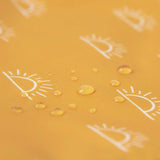 Close-up of water droplets on a yellow Bumkins Starter Bib 2 Pack: Sunshine and Grounded.