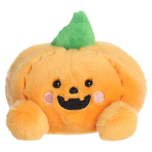 Aurora Palm Pals- Wisp Jack O' Lantern: plush orange pumpkin toy with green top, rosy cheeks, black eyes, and a smile.