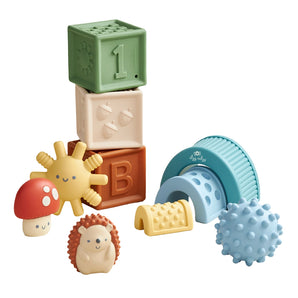 Itzy Ritzy Itzy Blocks: sensory blocks, hedgehog, mushrooms, spiked ball & rainbow arches in one colorful baby toy set.