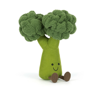 Jellycat Amuseables Broccoli toy with a smiling face sits upright, brown feet out, on a white background.