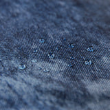 Close-up of water droplets on a Roamio by Bumkins Reusable Snack Bag, Large 2 Pack: Denim on Denim.