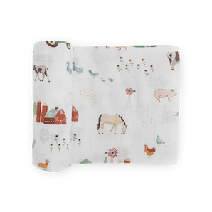 Little Unicorn Cotton Swaddle, Farmyard—soft, breathable muslin blanket with cute farm prints in gentle pastels for cozy cuddles.