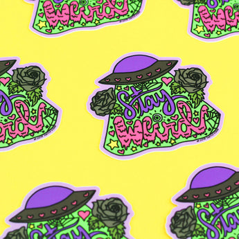 Turtle Soups Vinyl Sticker: An alien in a purple hat, green roses, and Stay Weird on yellow—fun, colorful, and weatherproof!.