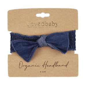 Denim Smocked Headband: dark navy blue headband on tan cardboard packaging card; Lovedbaby logo with text "Organic Headband 0-12 M"