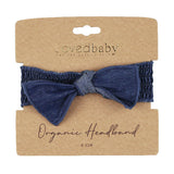 Denim Smocked Headband: dark navy blue headband on tan cardboard packaging card; Lovedbaby logo with text "Organic Headband 0-12 M"