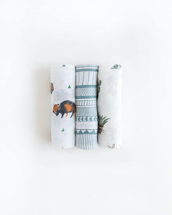 Little Unicorns Cotton Swaddle Set includes three blankets with bison, geometric patterns, and turtle prints on a white background.
