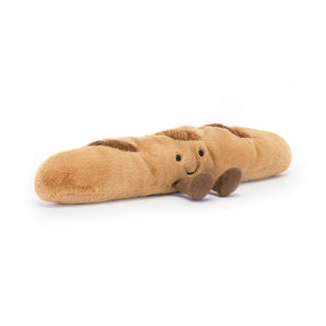 Jellycat Amuseables Baguette is a cute plush loaf with a smile and brown legs, perfect for snuggles.