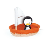 PlanToys Sailing Boat, Penguin features a penguin in a small orange vessel with a white PlanToys sail made from sustainable PlanWood.