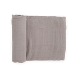 The Little Unicorn Cotton Swaddle in Porpoise, folded and rolled, sits on a white background.