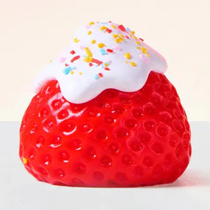 Showcase Squeezesquad - Strawberry: a red squishy fidget toy with white frosting and sprinkles—fun stress relief for all!.