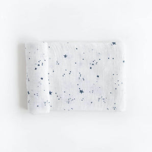 Little Unicorn Cotton Swaddle, Shooting Stars: soft, breathable muslin with blue stars on white—perfect comfort for babies.