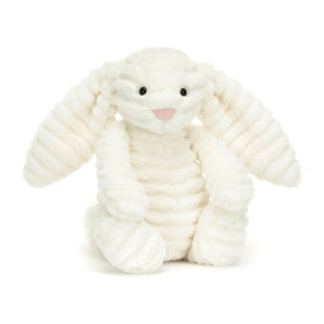 Jellycat Bashful Bunny Luxe Nimbus, a plush lop-eared bunny, sits upright with stitched nose and button eyes against a plain background.