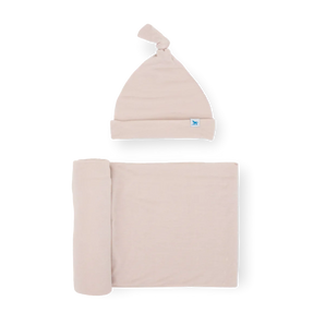 The Soft Knit Swaddle and Hat Set in Soft Blush by Little Unicorn makes the perfect newborn gift.