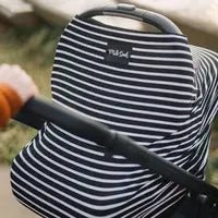 Load image into Gallery viewer, Milk Snobs Cover Modern Stripe on a baby stroller outdoors, with a hand pushing it.

