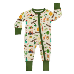 Sleeper, All Abroad Dino Train: beige long sleeve pajamas with dinosaur & train pattern, green cuffs, & front zipper; made of bamboo viscose.