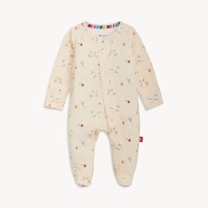 Magnetic Me Footie Special Delivery: cream modal sleeper with long sleeves, bear/tree prints & magnetic closures, laid flat on white.