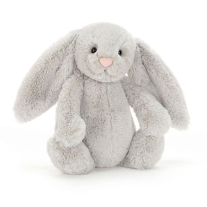 Jellycat Bashful Bunny Silver Medium has soft gray fur, floppy ears, black eyes, and a pink nose against a white background.