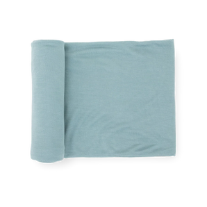 Little Unicorn Stretch Knit Swaddle Blanket - Harbor, light blue, partially unrolled on a white background.