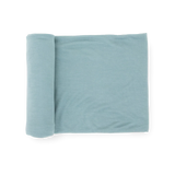 Little Unicorn Stretch Knit Swaddle Blanket - Harbor, light blue, partially unrolled on a white background.