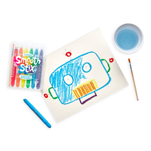 Load image into Gallery viewer, An OOLY robot uses Smooth Stix Watercolor Gel Crayons to draw on paper with a paintbrush nearby.
