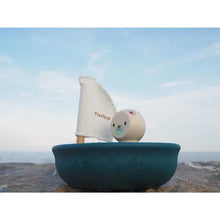 Load image into Gallery viewer, Sailing Boat, Polar Bear by PlanToys: A toy sailboat featuring a smiling bear and fabric sail. Enjoy sustainable play!.
