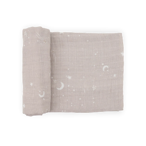 Little Unicorn Organic Cotton Muslin Swaddle- Moon Dust: light brown with white moons, stars & clouds, partially rolled.