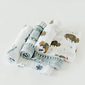 The Little Unicorn Cotton Swaddle Set, Bison, includes 4 breathable muslin blankets with bison, cactus, and geometric designs.
