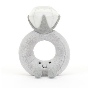 Jellycat Amuseable Diamond Ring is a plush toy shaped like a smiling diamond ring, featuring soft silver fur and charm.