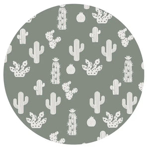 The Sleeper, Stay Sharp by Emerson and Friends features a muted green background with white cacti, reminiscent of bamboo baby pajamas.