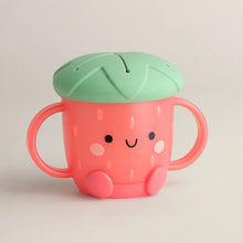 Load image into Gallery viewer, The Itzy Ritzy Itzy Snack Cup is a cute strawberry-shaped sippy cup with a silicone lid, leaf top, and easy-grip handles.
