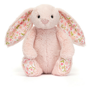 Jellycat Blossom Bunny Cherry Small—a pink plush bunny with floral ears and feet—sits facing forward on a white background.