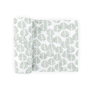 Little Unicorn Cotton Muslin Swaddle Blanket in Leaf Motif, partially rolled, shown on a plain light background.