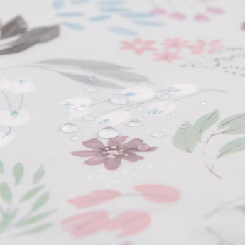 Close-up of water droplets on Bumkins Splat Mat: Floral.
