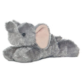 Aurora Mini Flopsie Ellie, a plush elephant with big pink ears, lies on its stomach facing left against a white background.