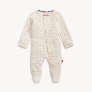 Magnetic Me Footie Heart & Bow: a cream organic cotton sleeper with pink bow print and colorful strip, by Magnetic Me.