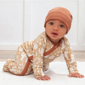 Romper, Wild West Brown by Tesa Babe: baby in a brown patterned onesie and matching beanie, crawling on soft hypoallergenic fabric.