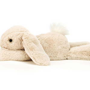 Jellycat Smudge Rabbit is a plush beige bunny with floppy ears and a fluffy tail—perfect as a baby gift from Jellycat.