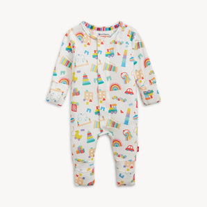 Magnetic, Coverall Play All Day: white coverall long sleeve pajamas with colorful baby toy pattern & magnetic closure; made of TENCEL modal.
