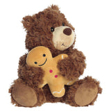 Aurora’s Bear w/ Gingerbread sits upright, exuding cozy holiday charm on a white background.