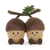 Jellycat Amuseables Ort & Tum Acorns—two cute acorns with smiling faces and green felt leaves—sit side by side on white.