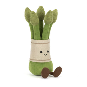 Jellycat Amuseables Asparagus plush with a smile, beige wrap, and brown feet sits upright on a white background.