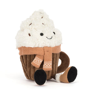 A smiling Jellycat Amuseables Scariffles Hot Chocolate plush shaped like a mug of cocoa with whipped cream and a tan scarf.
