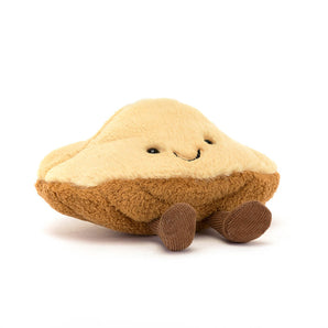 Jellycat’s Amuseables Margaux Madeleine is a dumpling-shaped plush with a smile and brown feet, perfect for any collection.