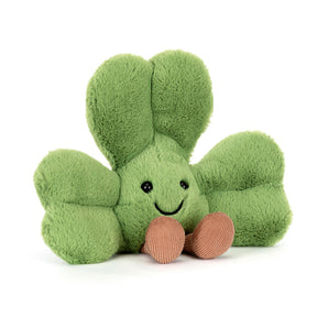 Jellycat Amuseables Siofra Shamrock: a plush green toy with a smile and corduroy legs, shown on a white background.