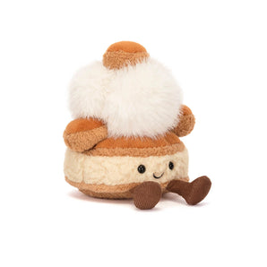 Jellycat Amuseables Mirielle St. Honoré: a cute cream puff plush with a smiling face and brown arms and legs.