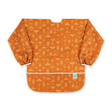 Load image into Gallery viewer, Bumkins Long-Sleeved Art Smock: Grounded features orange waterproof fabric with a white arrow pattern and an adjustable tie neck closure.
