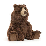 Jellycat Bizzlestomp Bear by Zoolikins sits upright, facing left, with soft brown fur and beige snout, paws, and inner ears.
